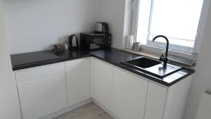 Kuchyňa alebo kuchynka v ubytovaní BTS Apartaments - Apartamenty Blisko Morza