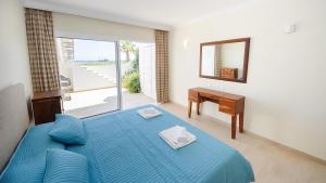 Postel nebo postele na pokoji v ubytování Luxury Bay View Villa 28 Right On The Beach + 6 fotografií