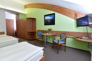 Katil atau katil-katil dalam bilik di Hotel Břízky
