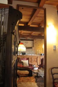 a view of a living room with a table and a mirror at Casaforte Alba In Langa in Mango