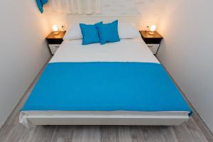 מיטה או מיטות בחדר ב-Apartmani Nikola