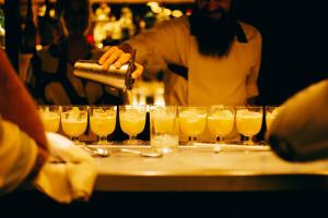 a bartender preparing a bunch of glasses of beer at Hotel Casa Bonay & Spa in Barcelona