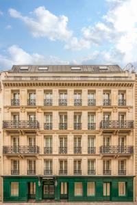 a large building with balconies on the front of it at Hotel Splendide Royal Paris - Relais & Châteaux in Paris