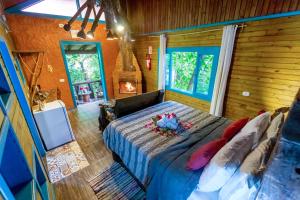 Ένα ή περισσότερα κρεβάτια σε δωμάτιο στο Pousada Refúgio das Montanhas