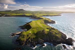an aerial view of a golf island in the ocean at Awelfryn in Pwllheli