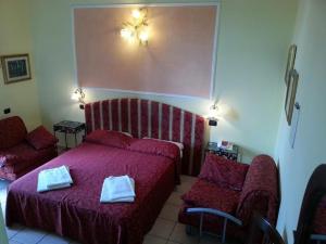 Postel nebo postele na pokoji v ubytování Hotel Sicilia