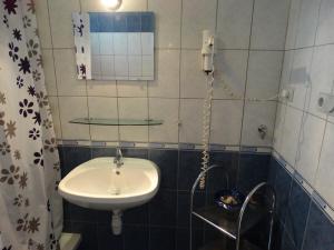 Kúpeľňa v ubytovaní Herkules apartman