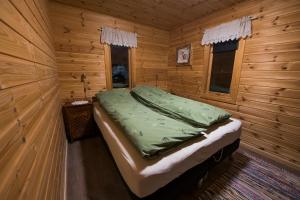 מיטה או מיטות בחדר ב-Bringnes Camp
