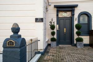 a front door of a house with a black door at 31 Meridian Place in Bristol