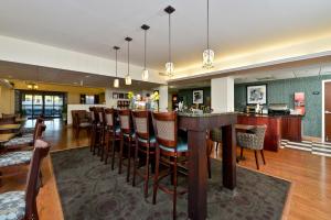 a bar in a restaurant with a bar stools at Comfort Inn Saco - Old Orchard Beach in Saco