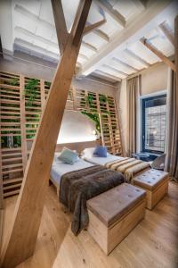 a bedroom with two beds and a vaulted ceiling at Benci House in Florence