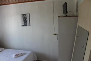 Postel nebo postele na pokoji v ubytování Edicula Fundos