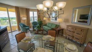 a living room with a glass table and a couch at Vacation Village at Weston in Weston