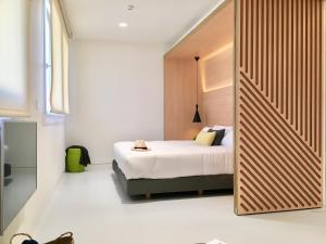 Кровать или кровати в номере Inside Bilbao Apartments