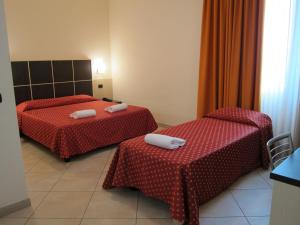 Voodi või voodid majutusasutuse Hotel Della Volta toas