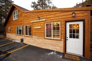 a building with a white door in a parking lot at Stonebrook Resort - Adult Only in Estes Park