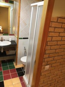 a bathroom with a toilet and a sink at Ventallols in Tarragona +24 photos