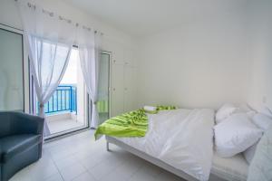 Кровать или кровати в номере Sea View Apartments