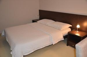 Postel nebo postele na pokoji v ubytování Hotel Golf Luxury