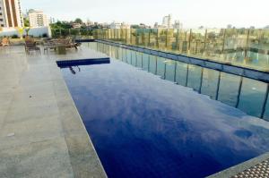 a large swimming pool on top of a building at Ville Celestine Hotel in Belo Horizonte