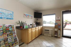 a kitchen with a counter in the corner of a room at Executive Inn - Panama City Beach in Panama City Beach
