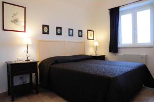 Tempat tidur dalam kamar di Torretta ai Sassi