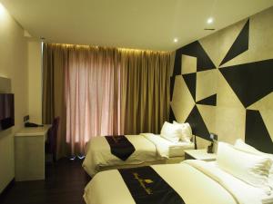 Postel nebo postele na pokoji v ubytování Mercury Boutique Hotel