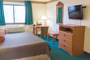 TV a/nebo společenská místnost v ubytování Guest House Inn + 10 fotografií