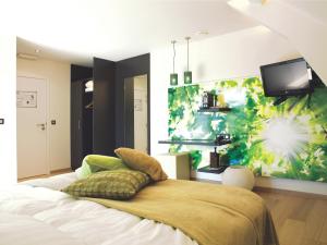 En eller flere senger på et rom på Hotel Aulnenhof