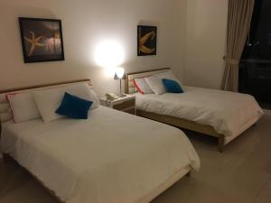 Кровать или кровати в номере The Suite Playa Blanca