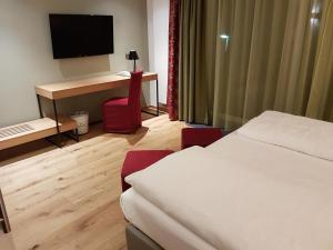 Ένα ή περισσότερα κρεβάτια σε δωμάτιο στο Hotel Kranebitt
