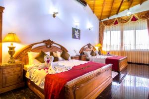 a bedroom with two beds in a room at Hotel Sudu Araliya in Polonnaruwa +60 photos