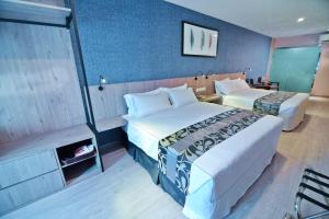 Postel nebo postele na pokoji v ubytování Diamond Inn