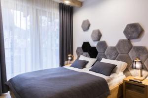 Posteľ alebo postele v izbe v ubytovaní Apartamenty Pod Giewontem + 37 fotografií