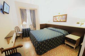 Łóżko lub łóżka w pokoju w obiekcie Hotel Sweet Home