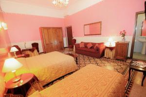 Łóżko lub łóżka w pokoju w obiekcie Hotel Sweet Home