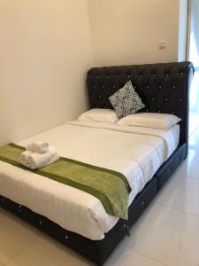Postel nebo postele na pokoji v ubytování ATS Cameron Hotel & Apartments