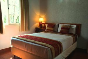 Una cama o camas en una habitación de Hotel Posada La Sorgente