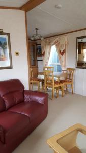 a living room with a couch and a table at Ruth's Repose in Shrewsbury