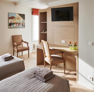 Letto o letti in una camera di Hotel Royal Astrid