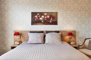 Letto o letti in una camera di Hotel Royal Astrid