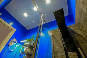 a bathroom with a blue ceiling with stars on the ceiling at Allegra's House Caracciolo in Rome