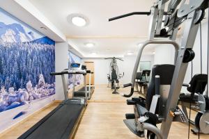 a gym with tread machines and a helicopter at Apartamenty Sun & Snow Resorts Lipki Park z sauną in Zakopane