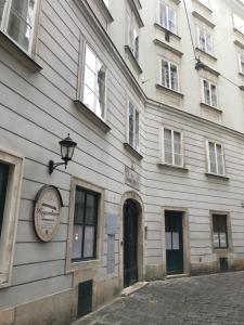 a building with a sign on the side of it at The Barts City Center - Self Check-in in Vienna