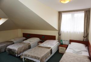 Tempat tidur dalam kamar di Pod Szczęśliwą Gwiazdą