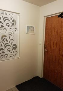 a room with a door and a picture on the wall at Sigurhæð - Apartment with all within your reach in Ísafjörður