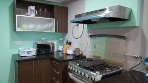 Virtuvė arba virtuvėlė apgyvendinimo įstaigoje Paraíso en el Caribe