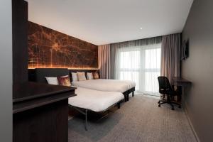 Postel nebo postele na pokoji v ubytování Heeton Concept Hotel – Luma Hammersmith