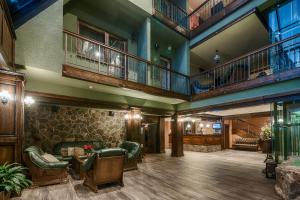 a lobby of a hotel with a large room at APLEND Wellness Hotel Borovica in Štrbské Pleso +70 photos