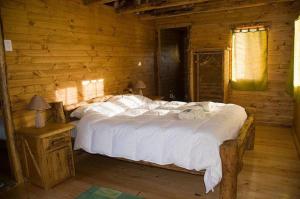 Postel nebo postele na pokoji v ubytování La Casa Escondida + 11 fotografií